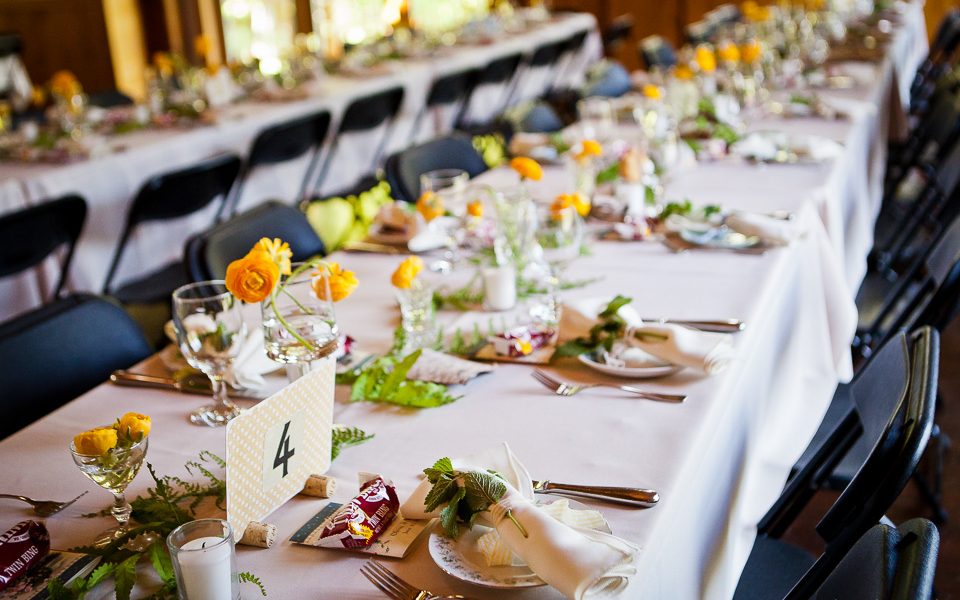 couple of long tables formally set with spring vibrance